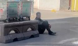 Hareketsiz bekleyen şahıs polisi alarma geçirdi